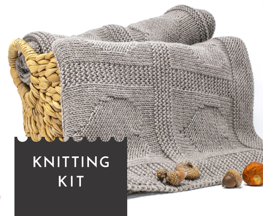 beige superwash merino wool yarn hand-knitted baby blanket in Hearts knitting pattern