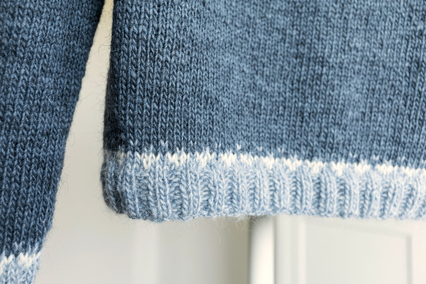 Close-up of a hem of Penguin icelandic lopapeysa sweater
