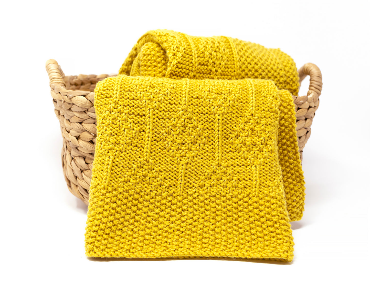 Yellow superwash merino wool DK yarn hand-knitted baby blanket in Diamonds knitting pattern