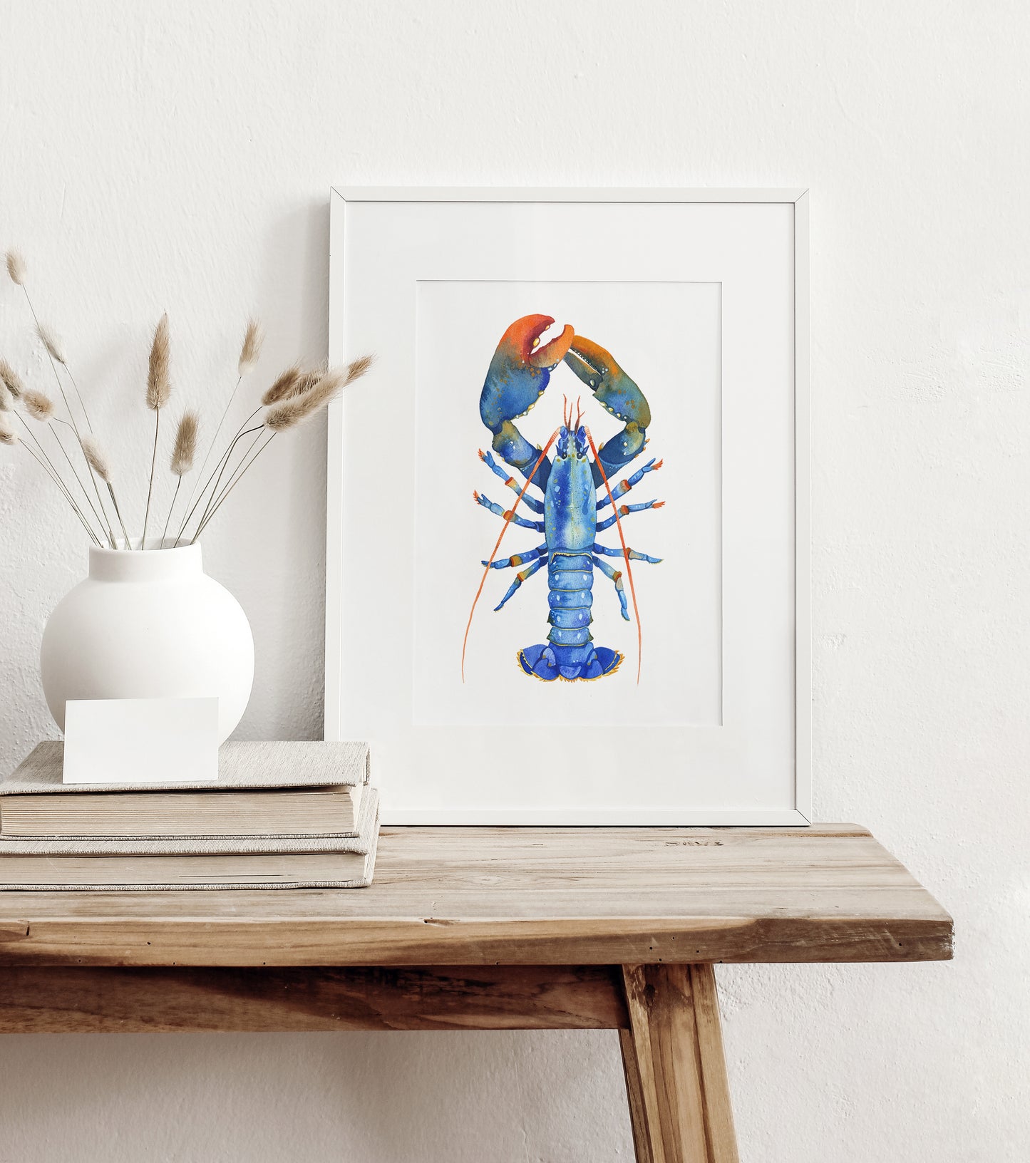 small Blue European lobster watercolor art print in a white frame