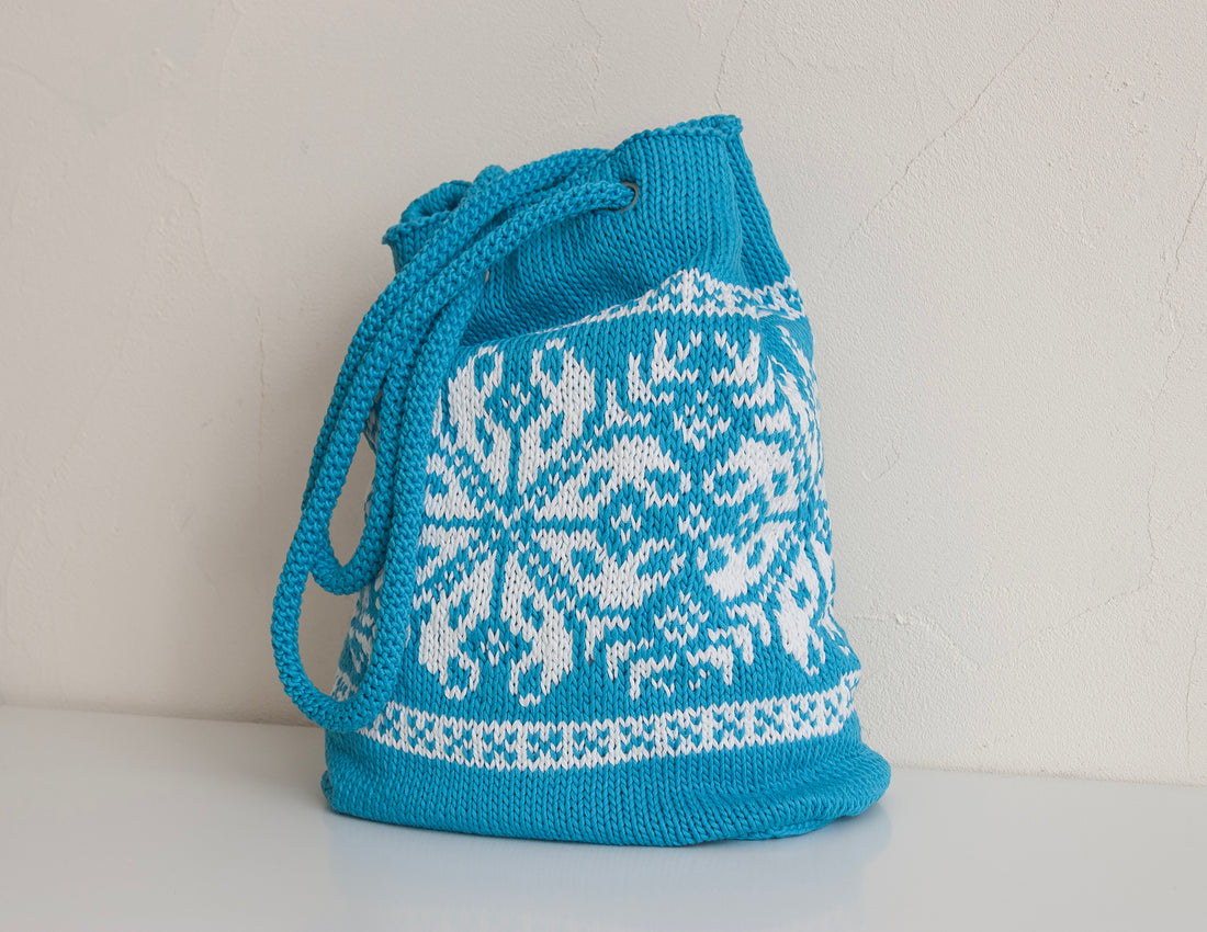 turquoise hand-knitted tote bag in nordic pattern