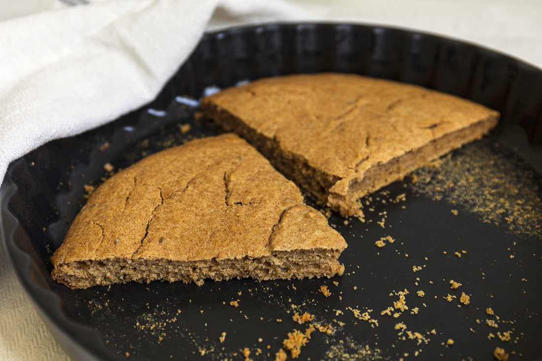 two slices of Estonian Barley Scones in a black baking form