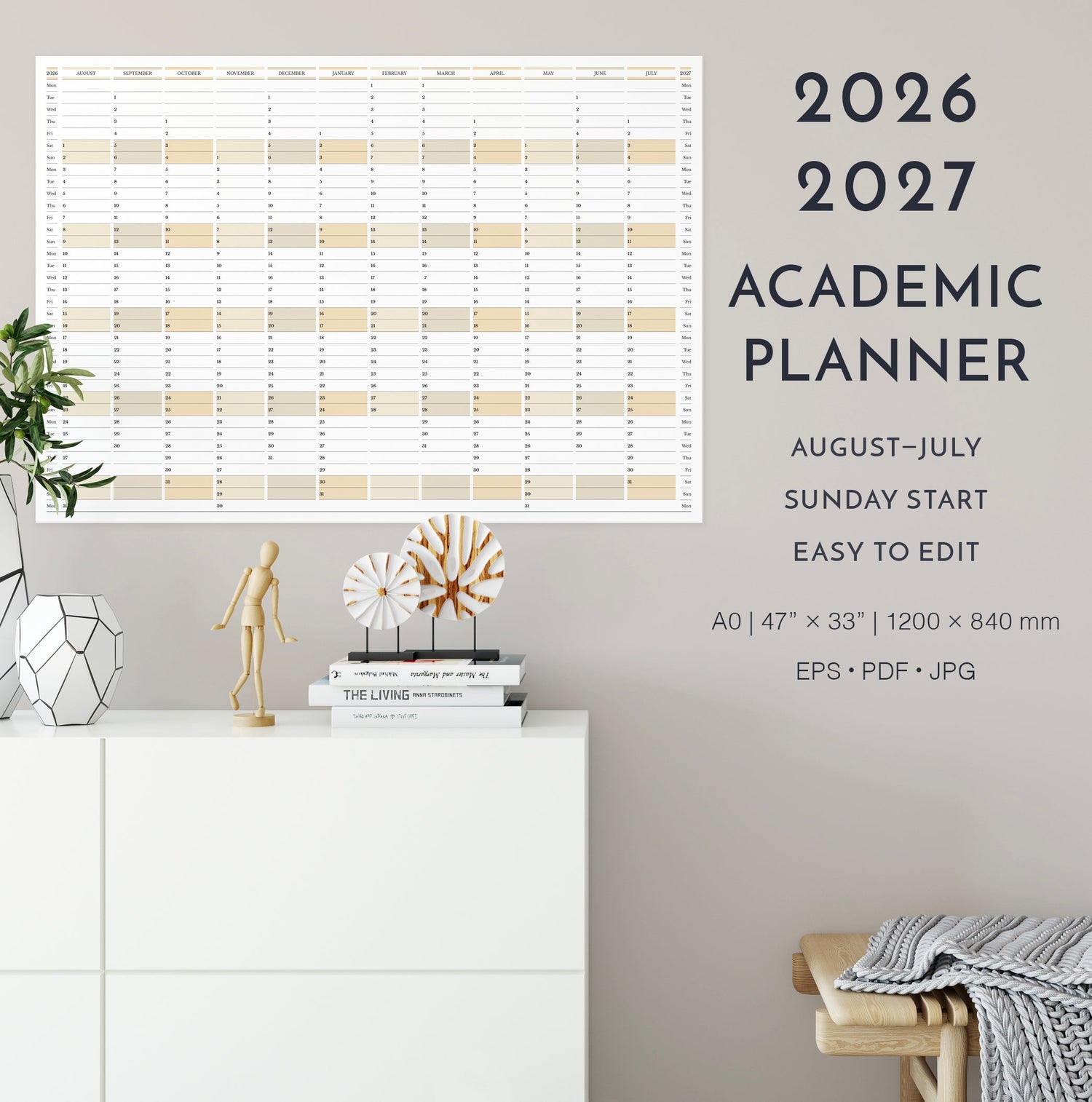 2026-2027 academic wall planner, Sunday start, landscape orientation, on a wall with decorative items below.