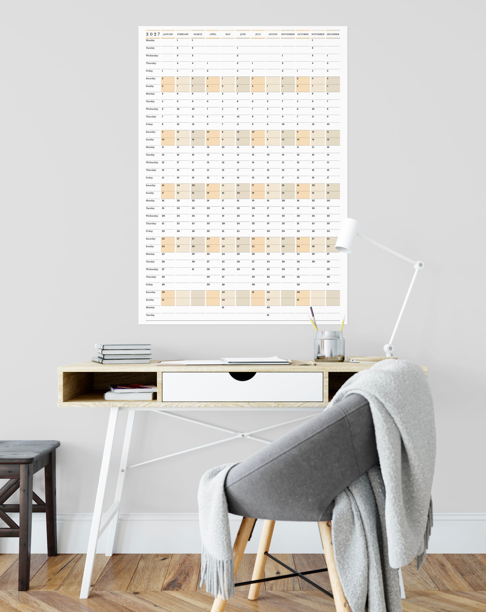 Home office with a desk, chair, and wall calendar.