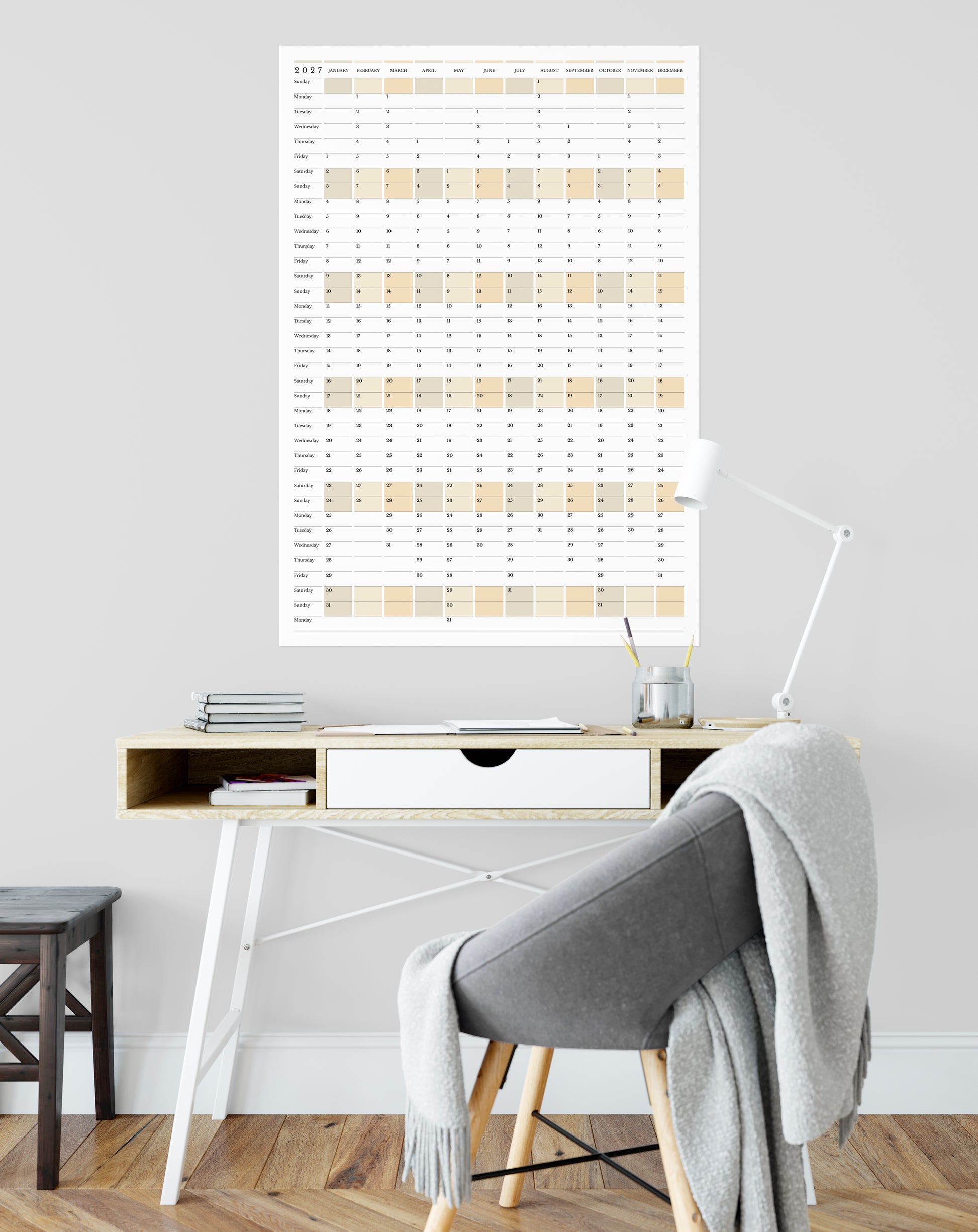Home office with a desk, chair, and wall calendar.