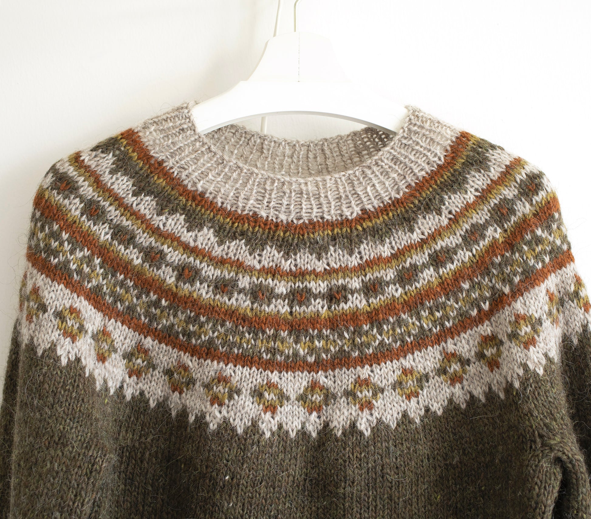 Close up for yoke of brown and beige Icelandic lopapeysa knitted sweater from Lettlopi pure Icelandic wool