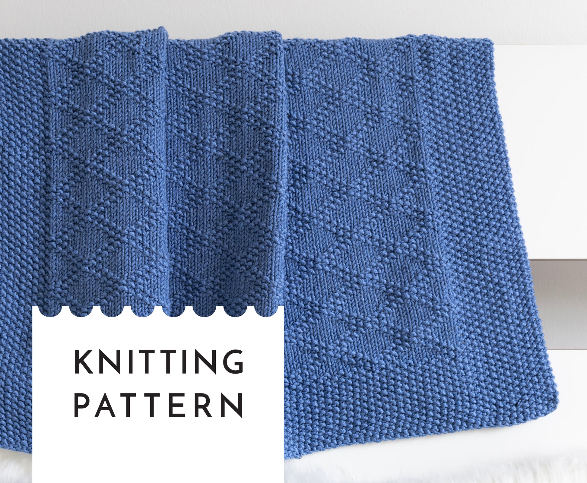 blue merino wool hand-knitted baby blanket in Harlequin knitting pattern