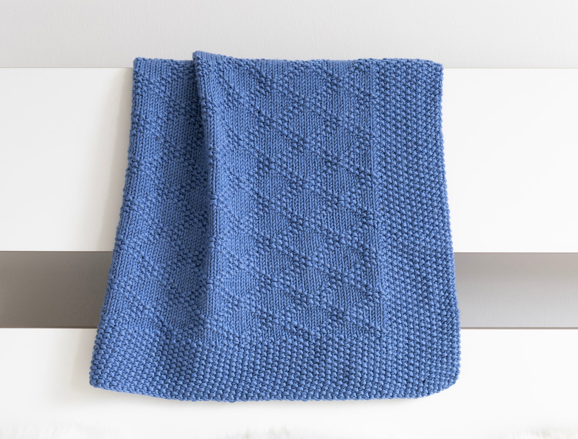 blue merino wool hand-knitted blanket in Charles Brocade pattern