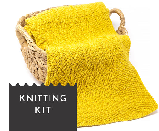 Yellow superwash merino wool DK yarn hand-knitted baby blanket in Diamonds knitting pattern