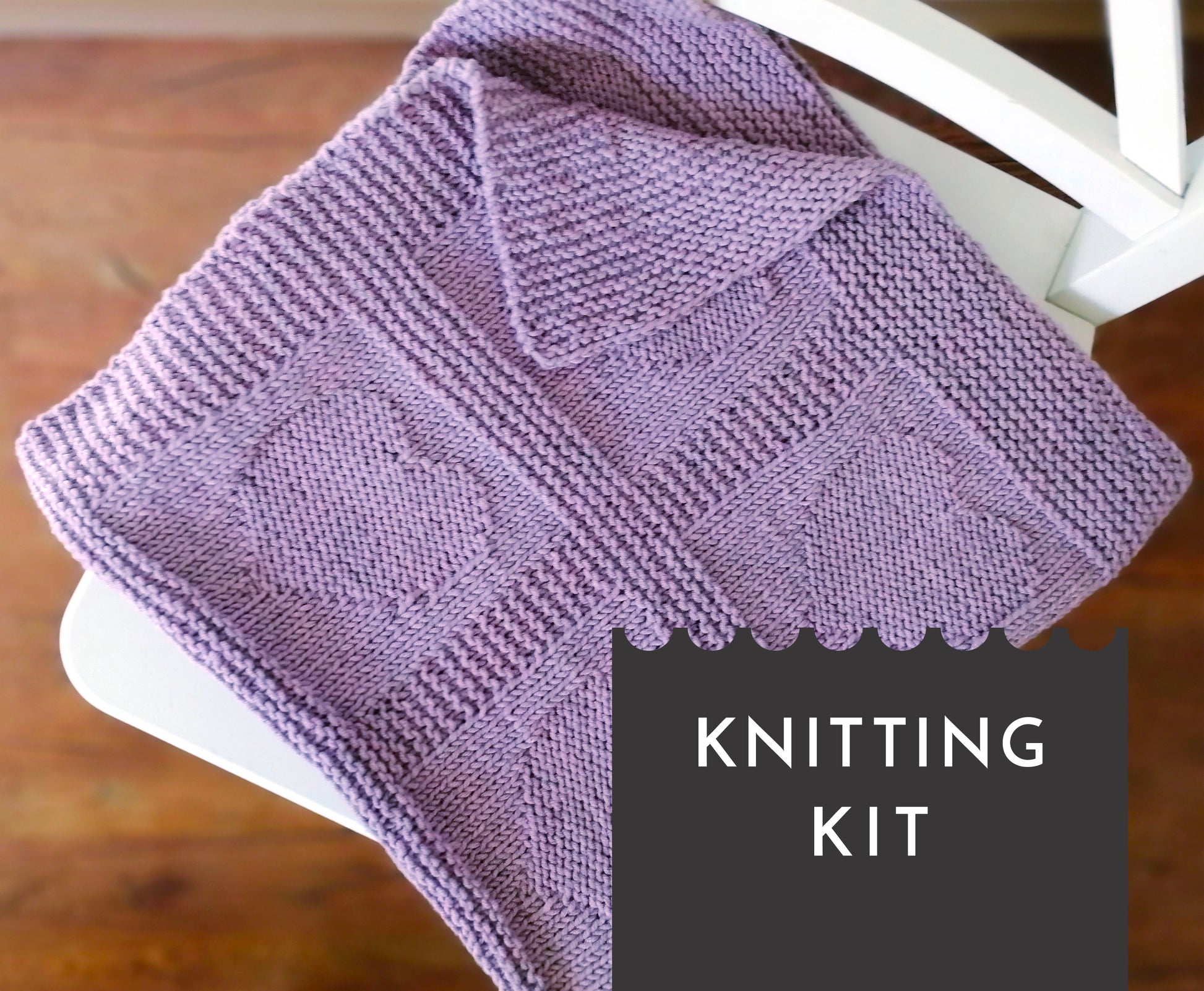 Purple superwash merino wool yarn hand-knitted baby blanket in Hearts knitting pattern