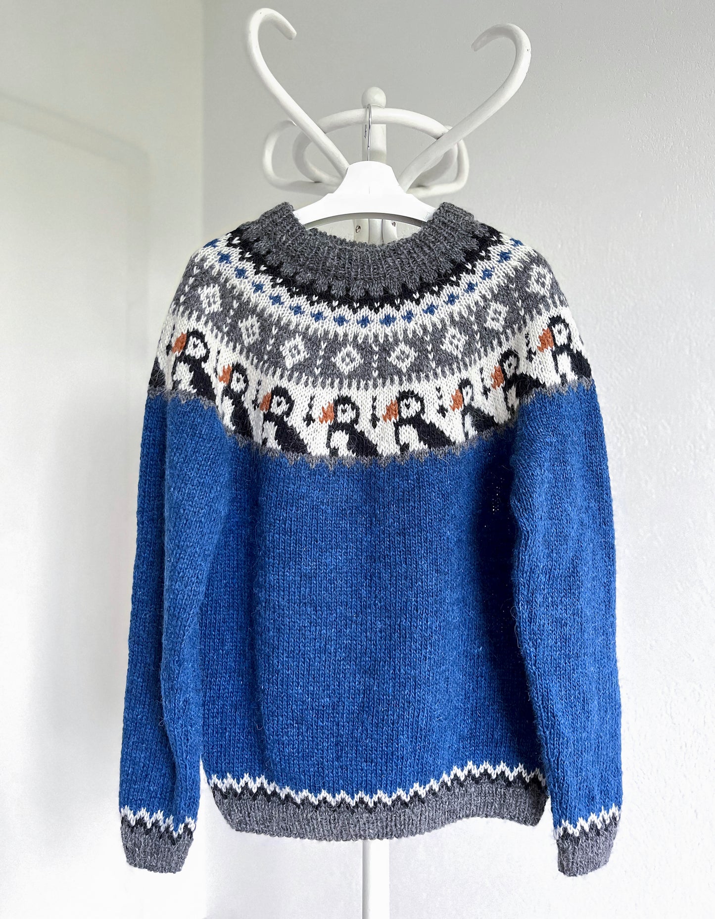 Blue, grey and white knitted Icelandic lopapeysa sweater in Puffins knitting pattern