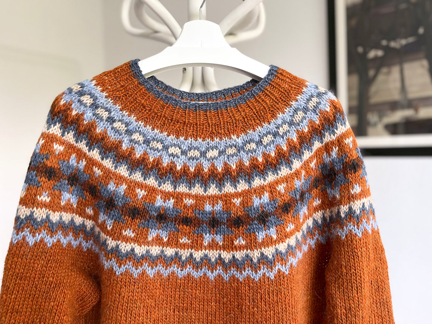 Details of Orange and blue Icelandic lopapeysa knitted sweater from Lettlopi pure Icelandic wool in Rósir design