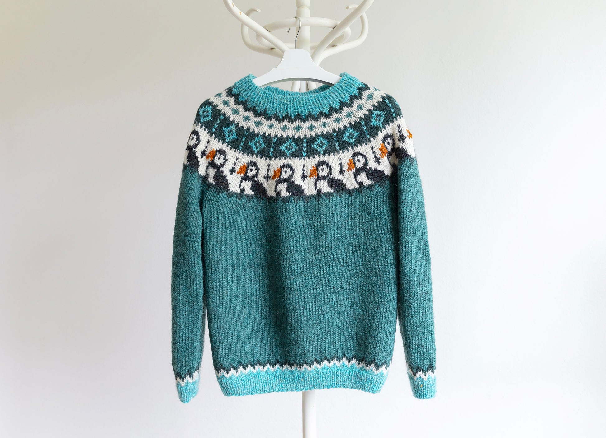 Turquoise and white knitted Icelandic lopapeysa sweater in Puffins knitting pattern