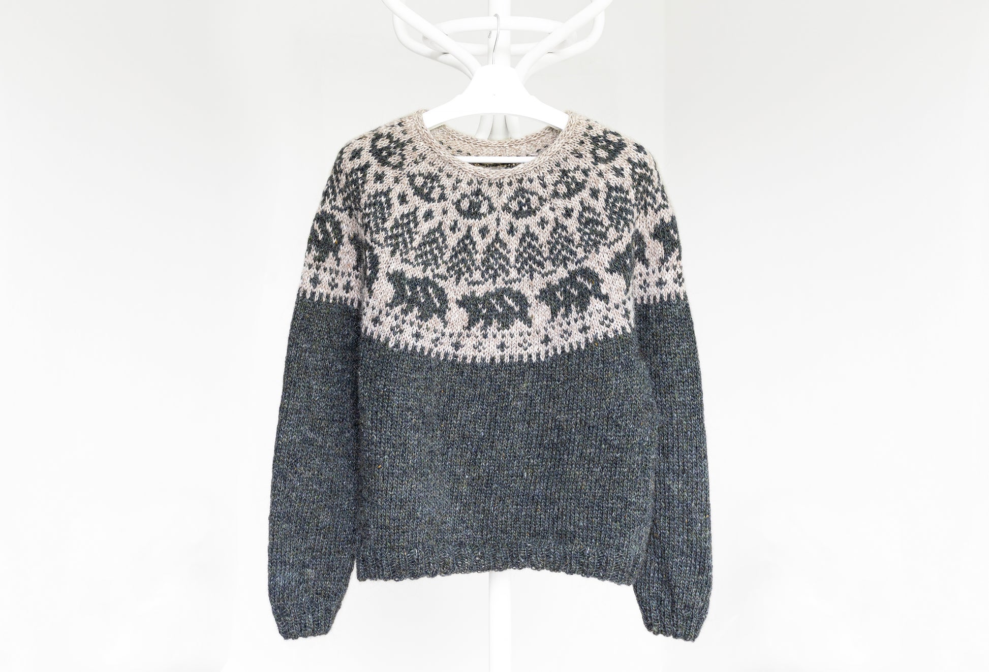 Mishka The Bear hand-knitted sweater with a patterned design on a white background