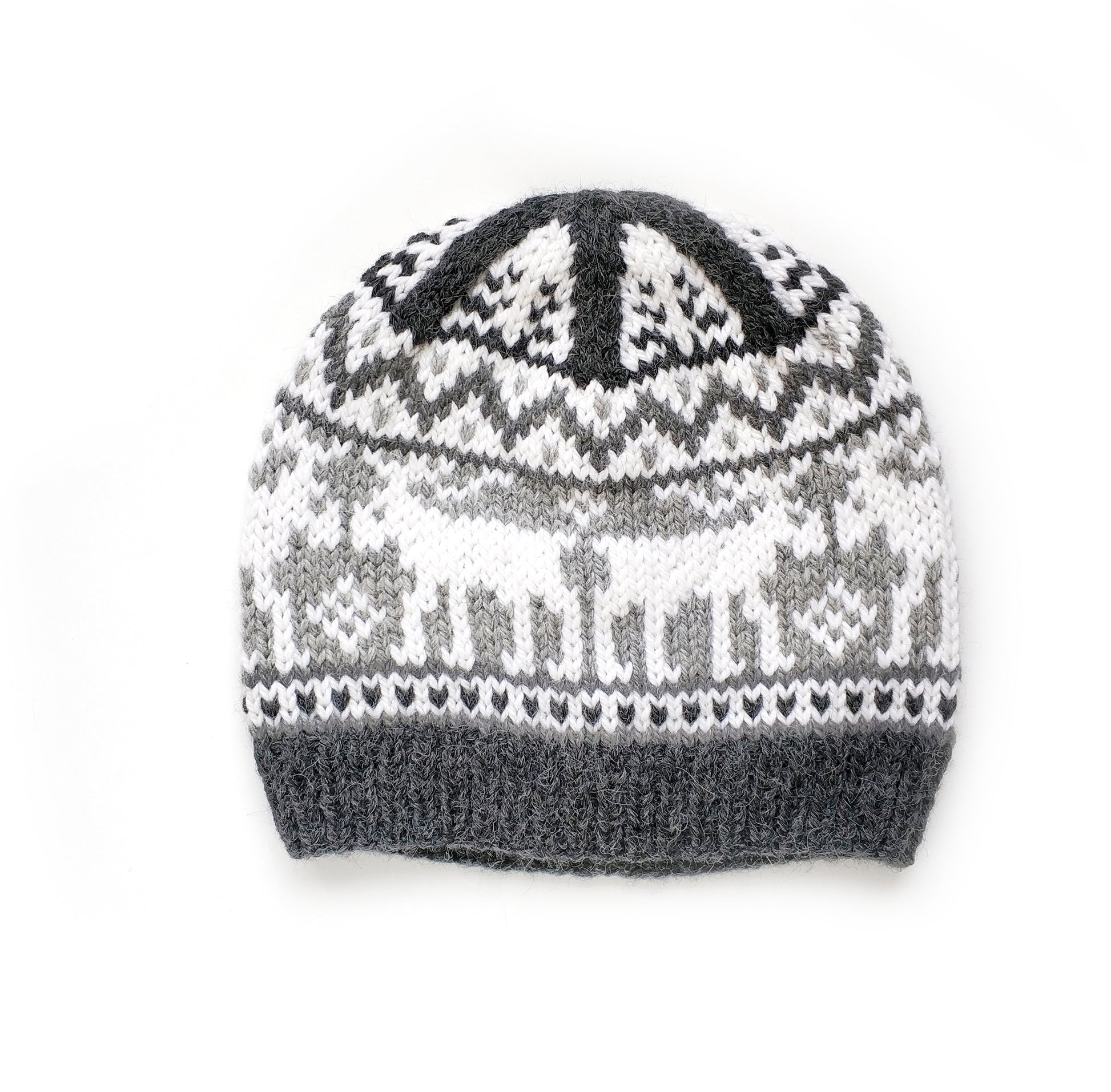 Front view oof a gray and white wool hand-knitted Fair Isle beanie hat featuring a moose motif