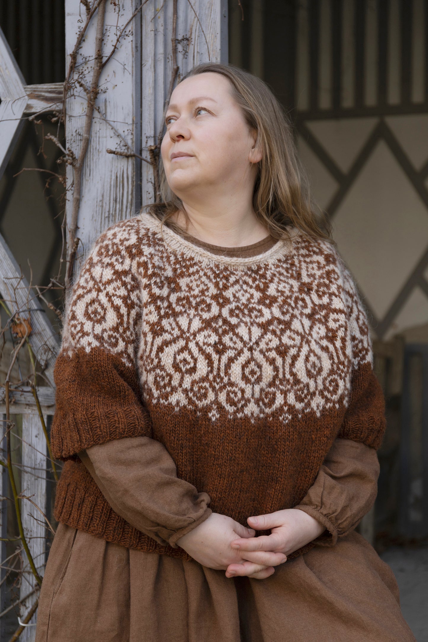 Woman performs Mora lopapeysa sweater