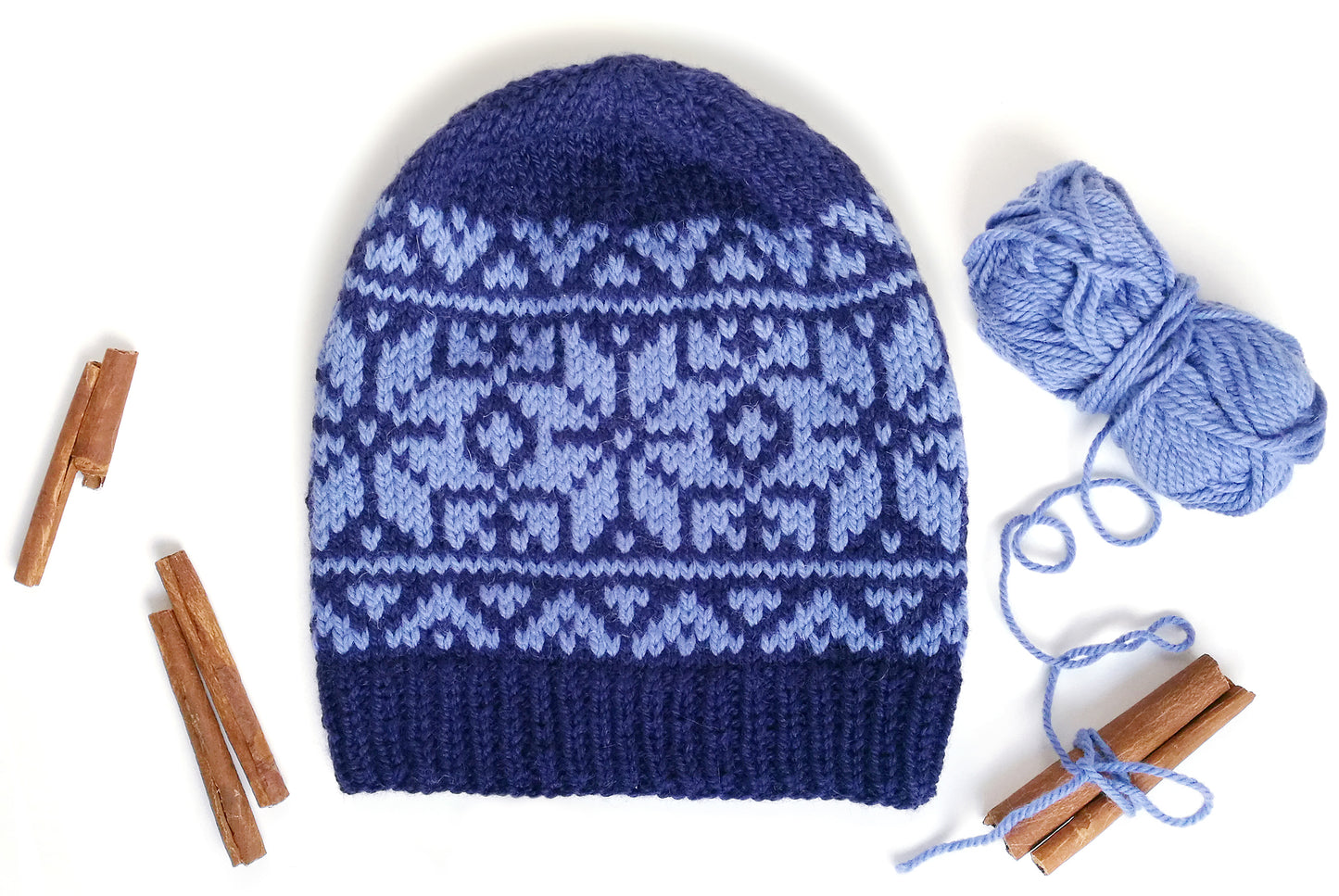 blue wool hand-knitted Fair Isle beanie hat in Roses knitting pattern