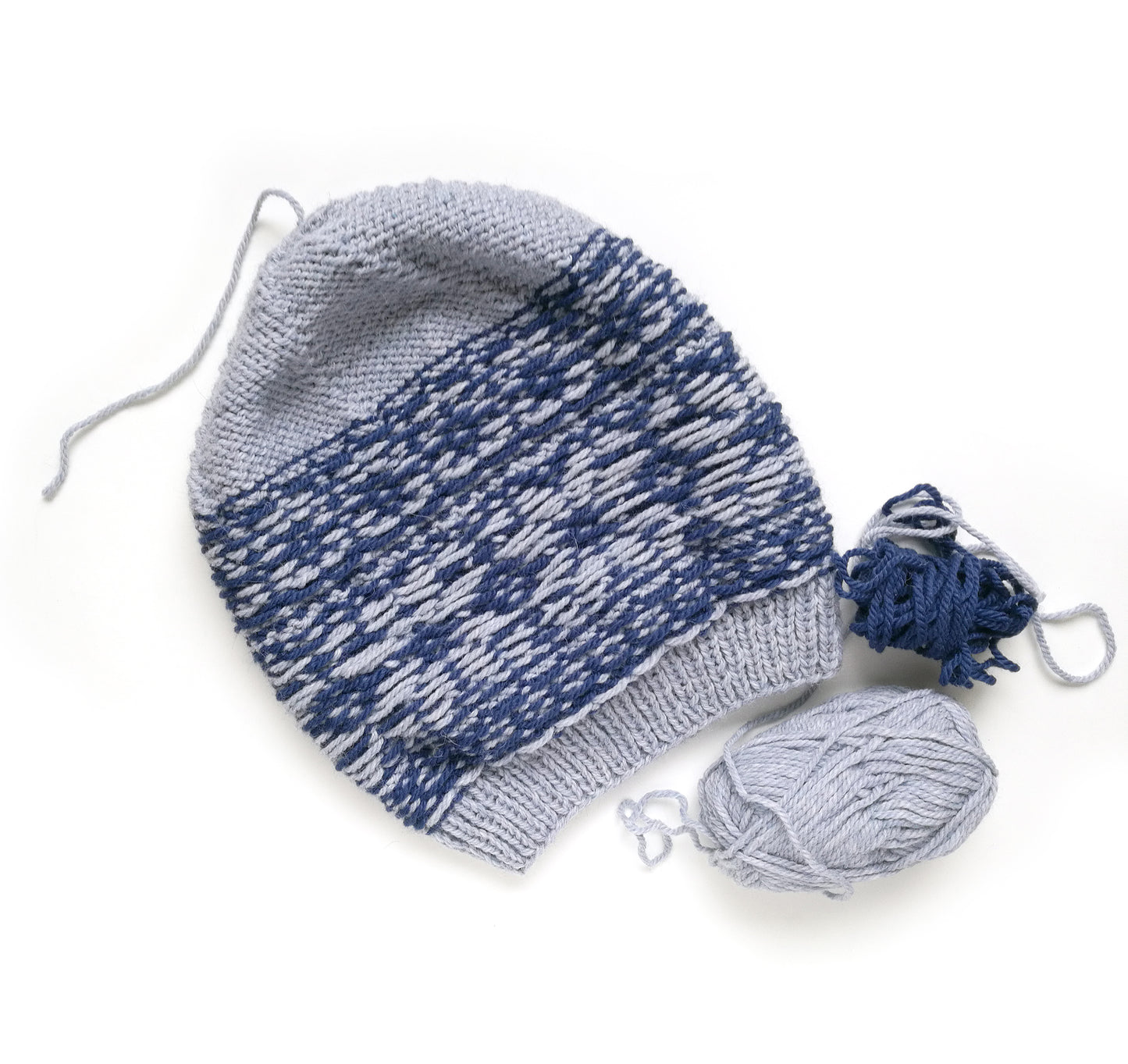 grey and blue wool hand-knitted Fair Isle beanie hat in Roses knitting pattern, wrong side
