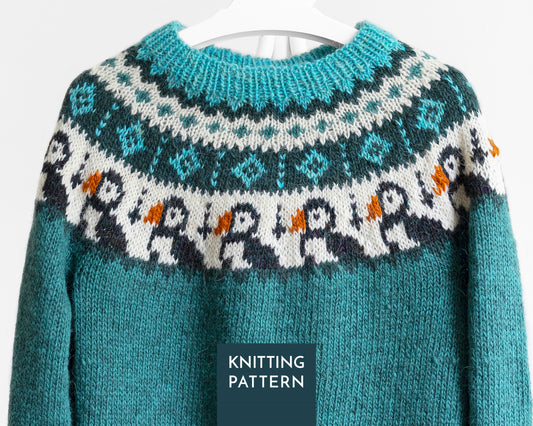 A teal icelandic lopapeysa sweater with a puffin pattern across the chest
