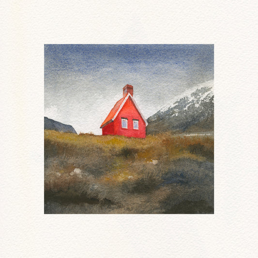 Red house with a red roof in a mountainous landscape