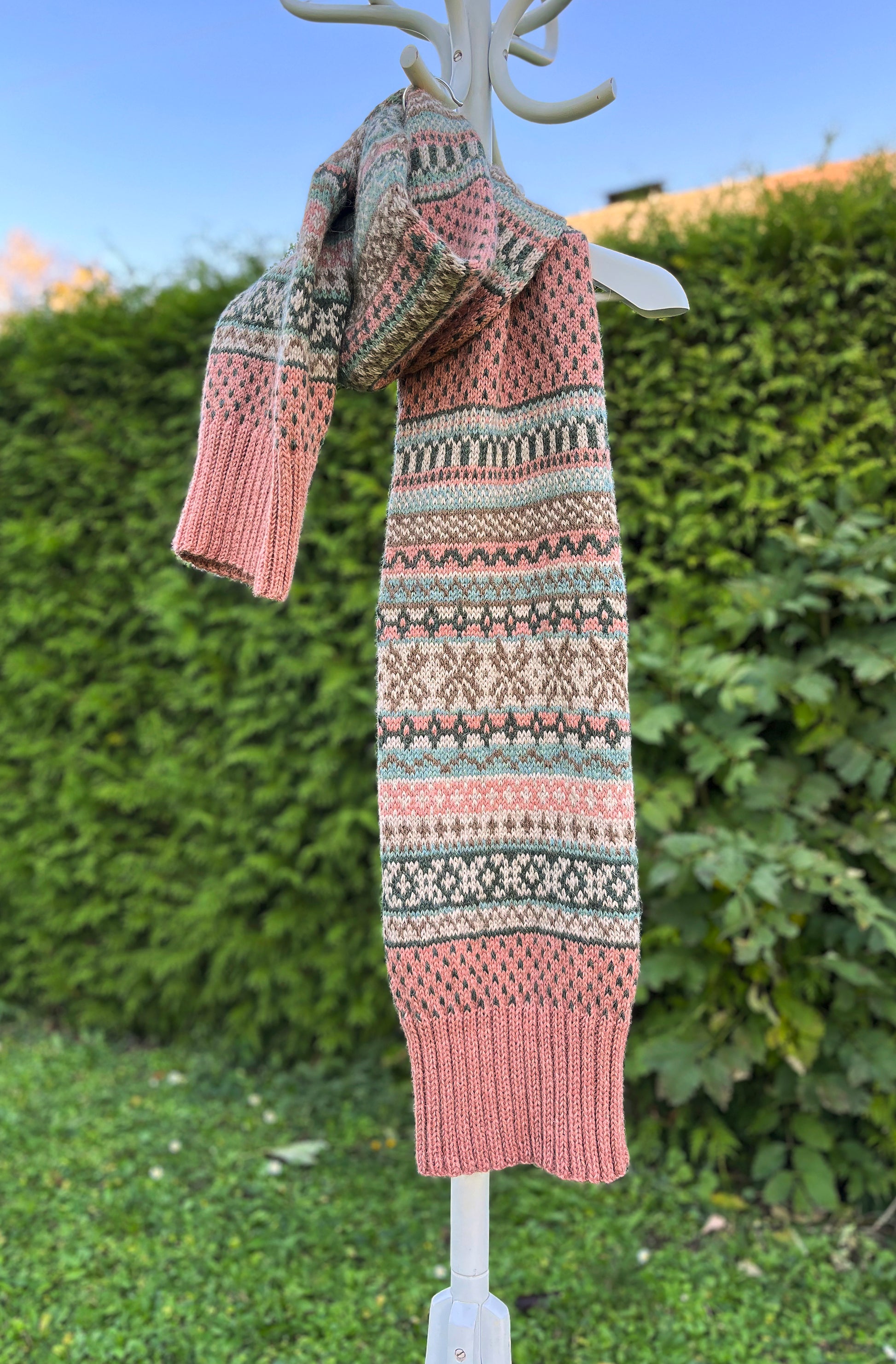 Rohukuela Fair Isle double-layer scarf on a greenery background