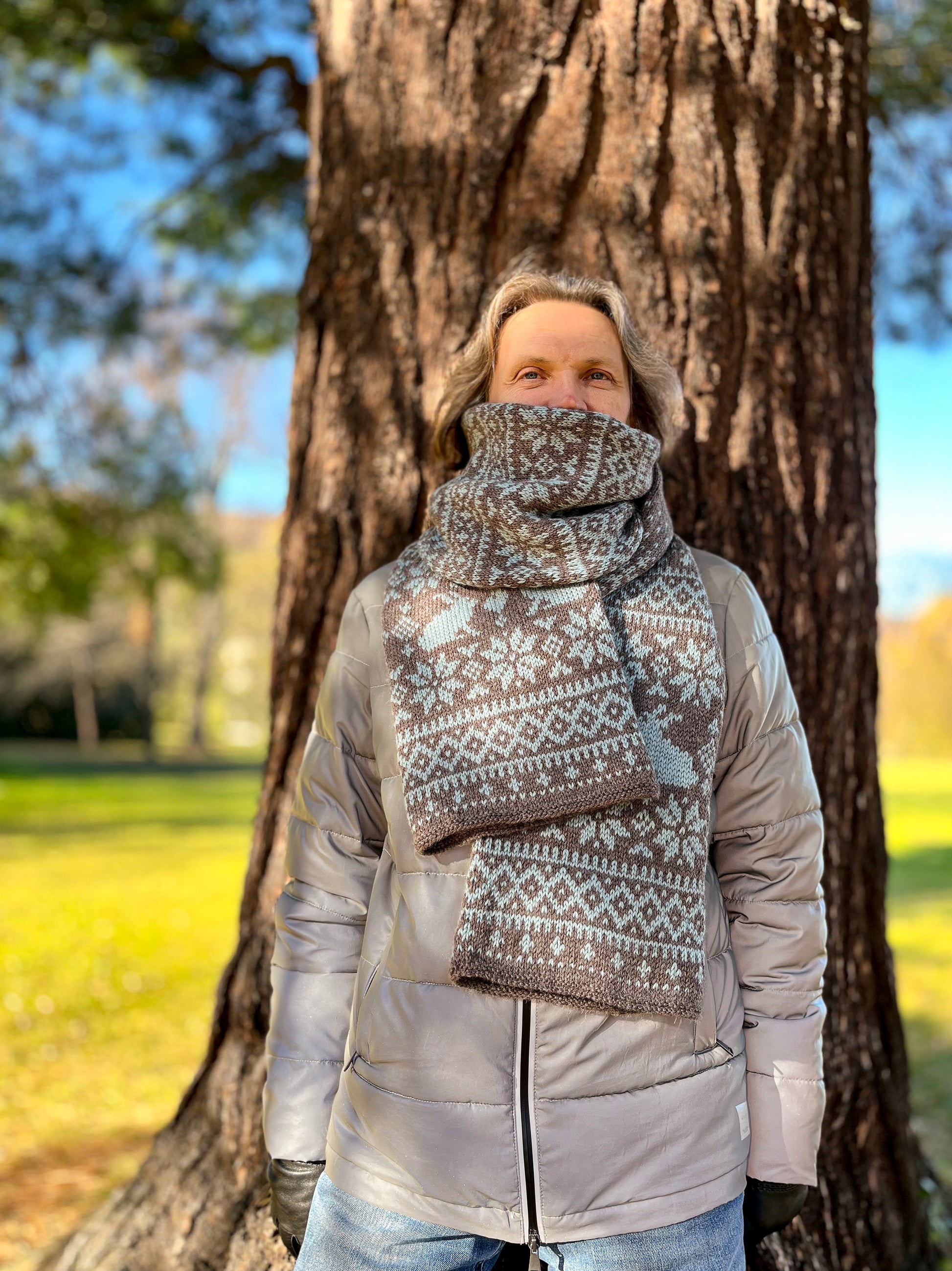 A man wears Sonka Bunny Fair Isle scarf