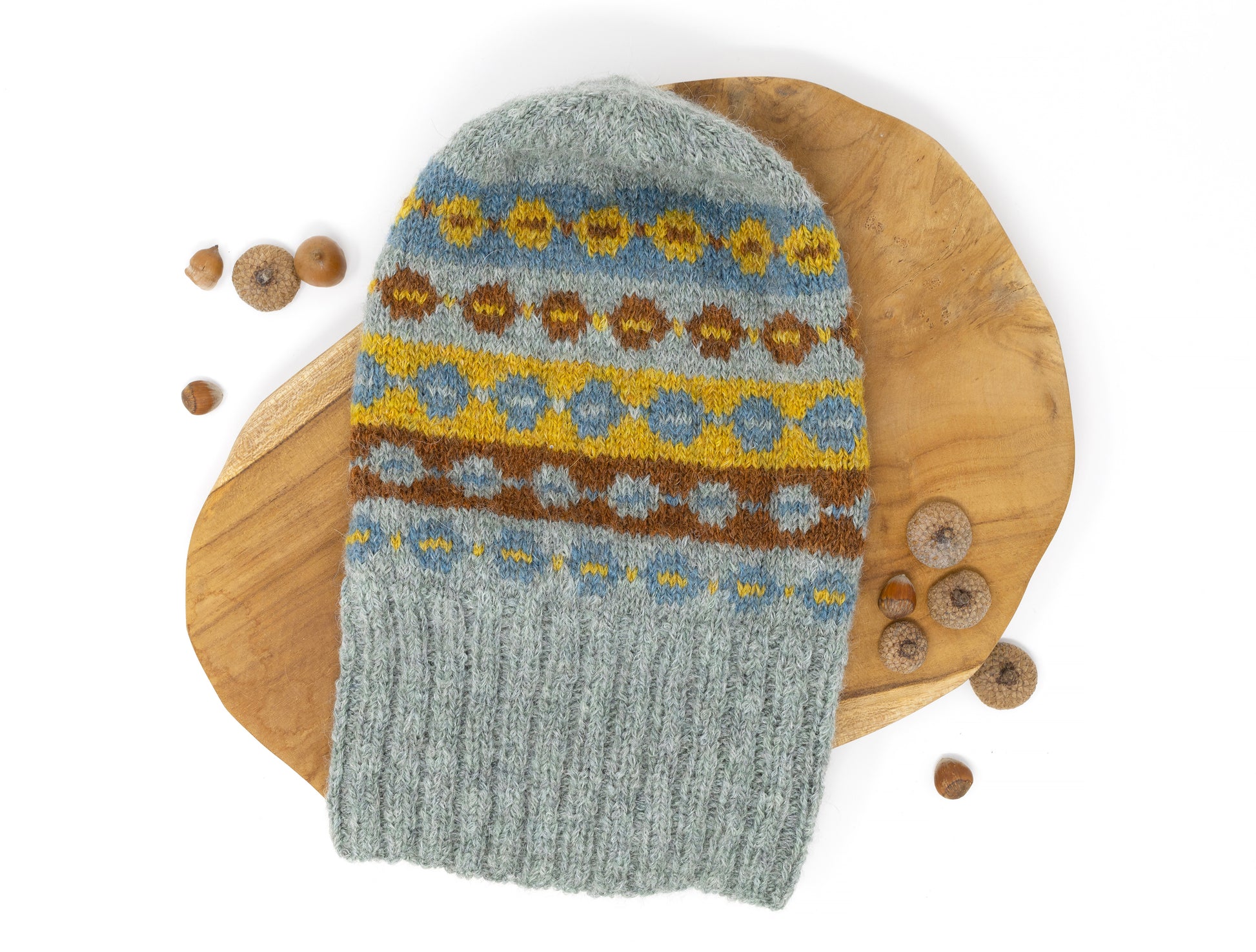 Grey, brown, yellow and blue alpaca wool hand-knitted Fair Isle hat with unfolded brim