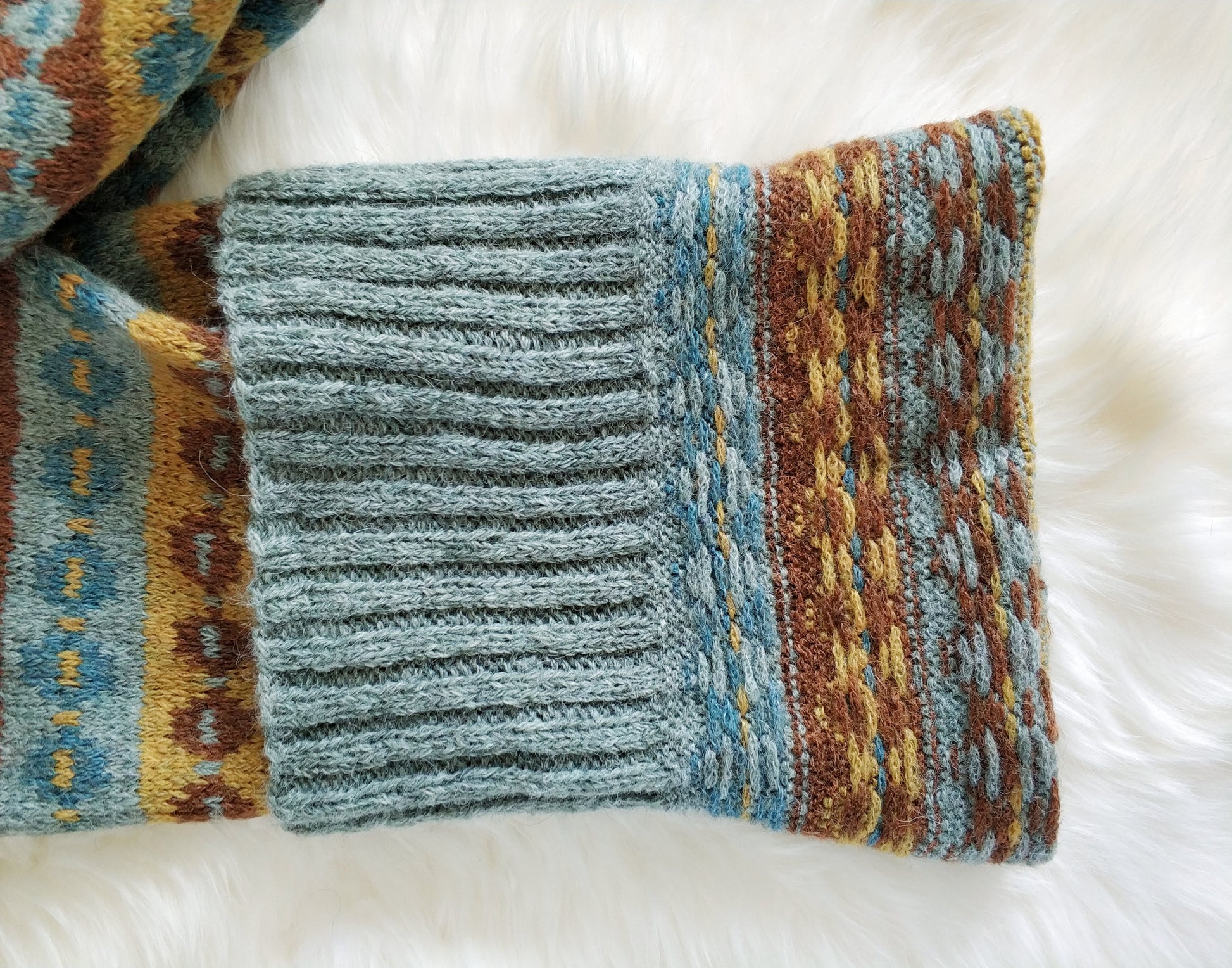 Grey, brown, yellow and blue alpaca wool hand-knitted Fair Isle long scarf, wrong side