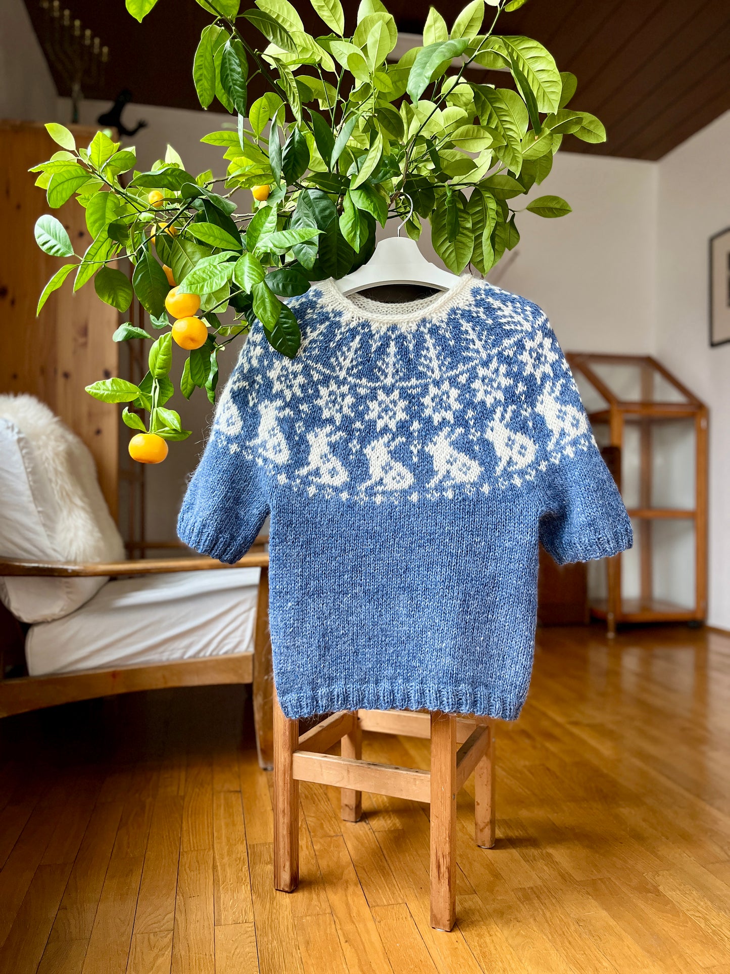 Front view of Vinterskog Bunny icelandic lopapeysa sweater in a room interior