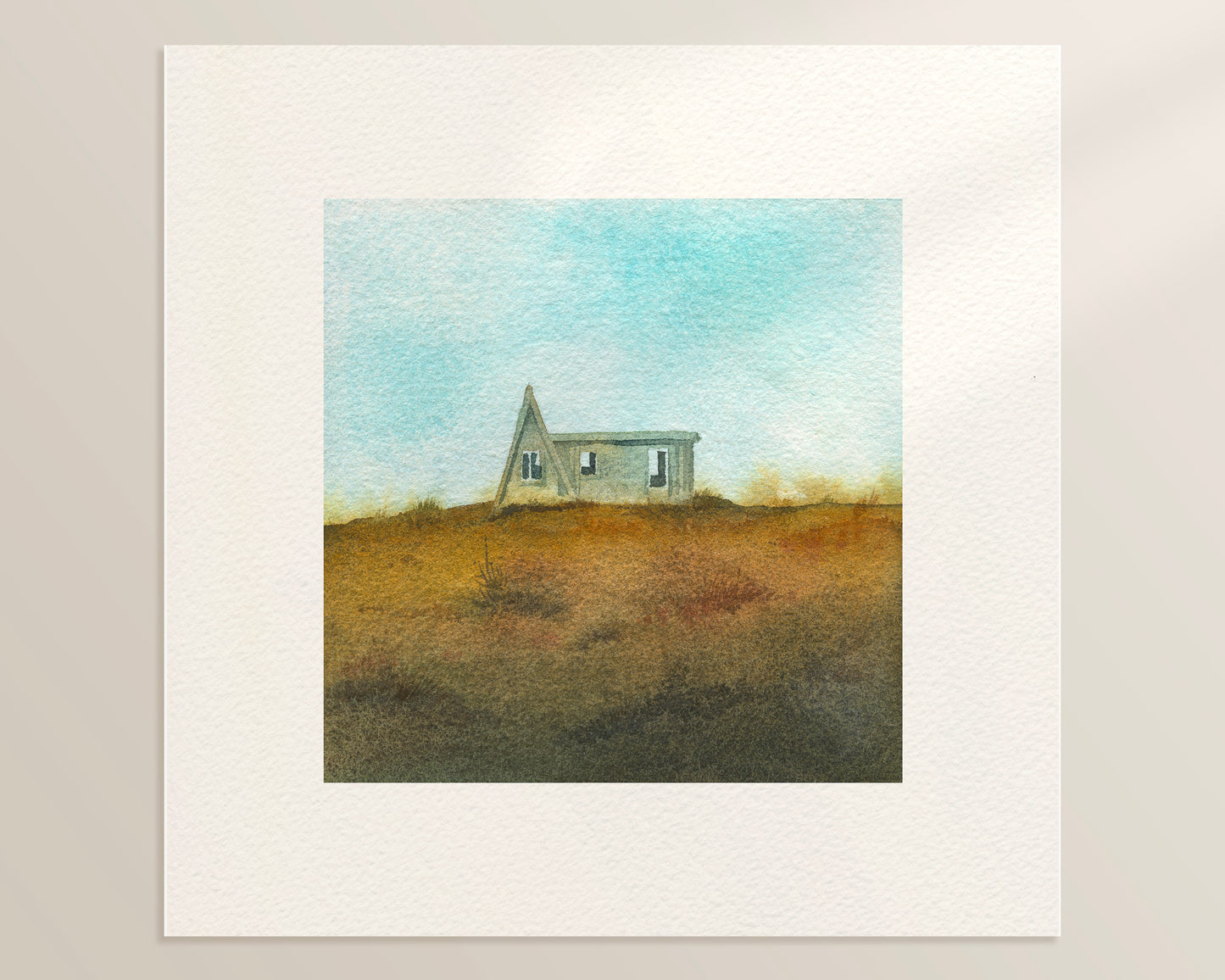 A watercolor painting featuring a small A-frame wooden cabin on a grassy hill under a light blue sky in the Westfjords, Iceland