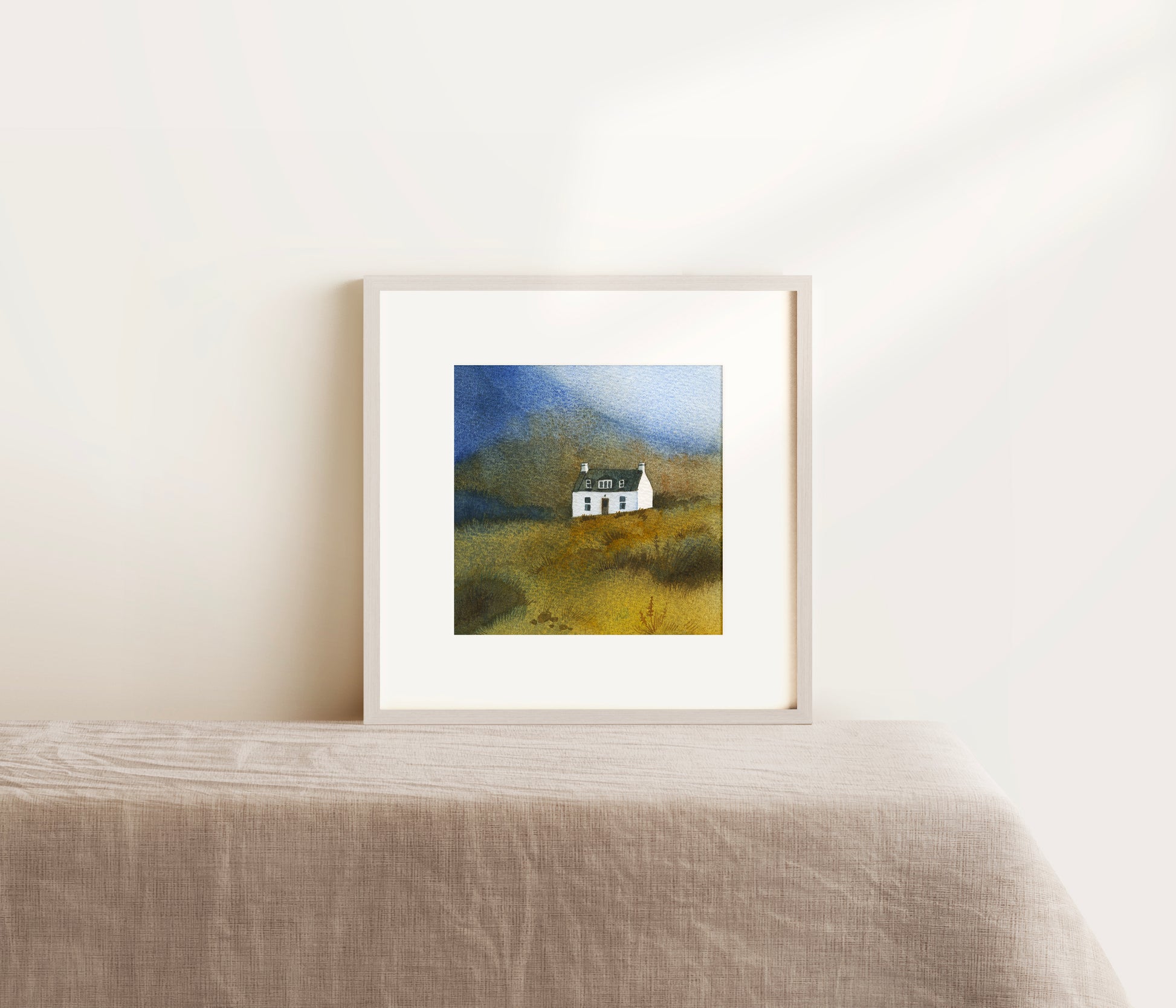 Framed watercolor painting featuring a small white Allt Dearg cottage sits below the Skye Ridge on the Isle of Skye, Scottish Highlands