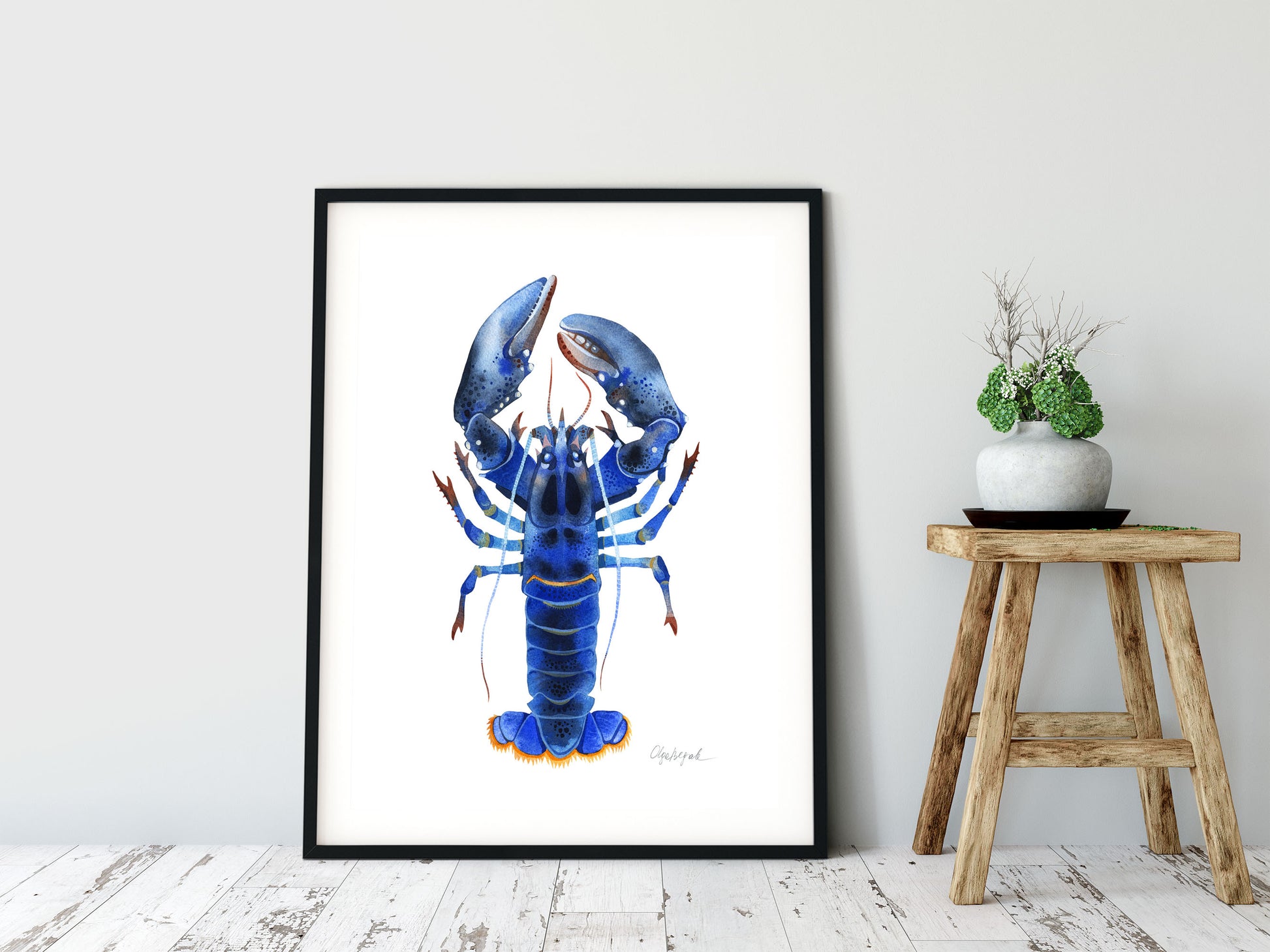 Blue Lobster watercolor print in a black frame