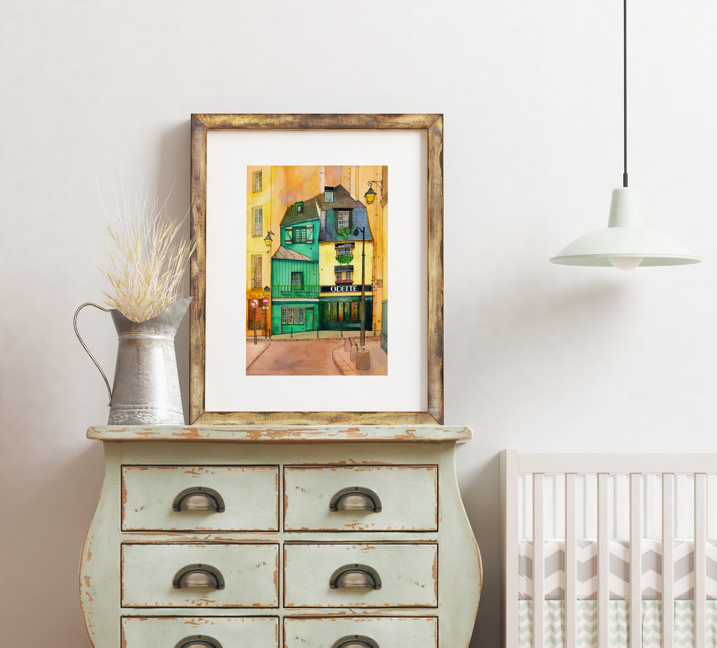 A print of Café Odette in Paris watercolor and ink artwork in a wooden frame