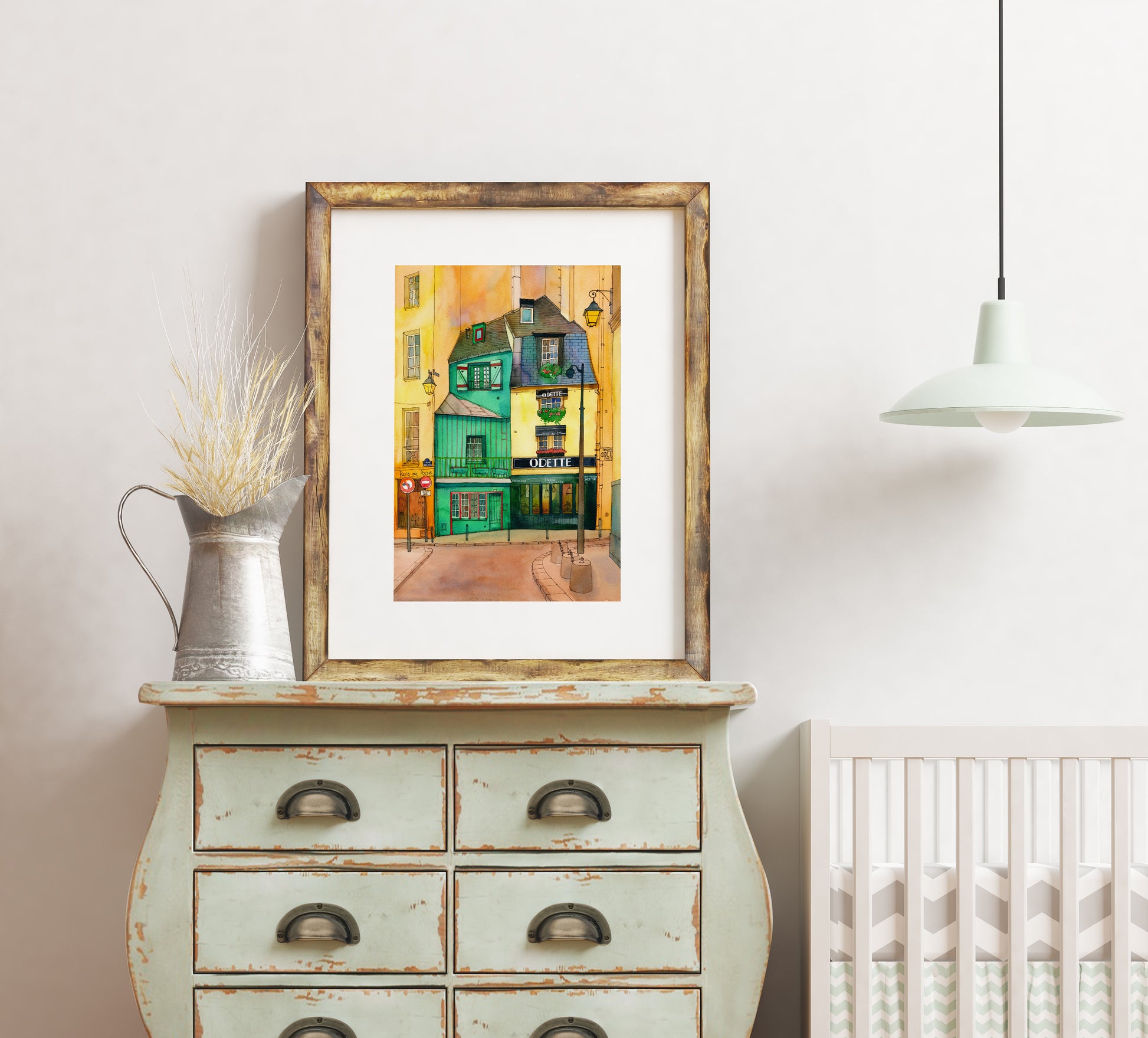 A print of Café Odette in Paris watercolor and ink artwork in a wooden frame