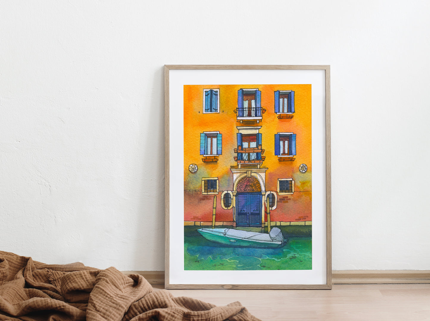 Large framed watercolor artwork of a yellow house with a boat on Fondamenta de la Misericordia in Venice