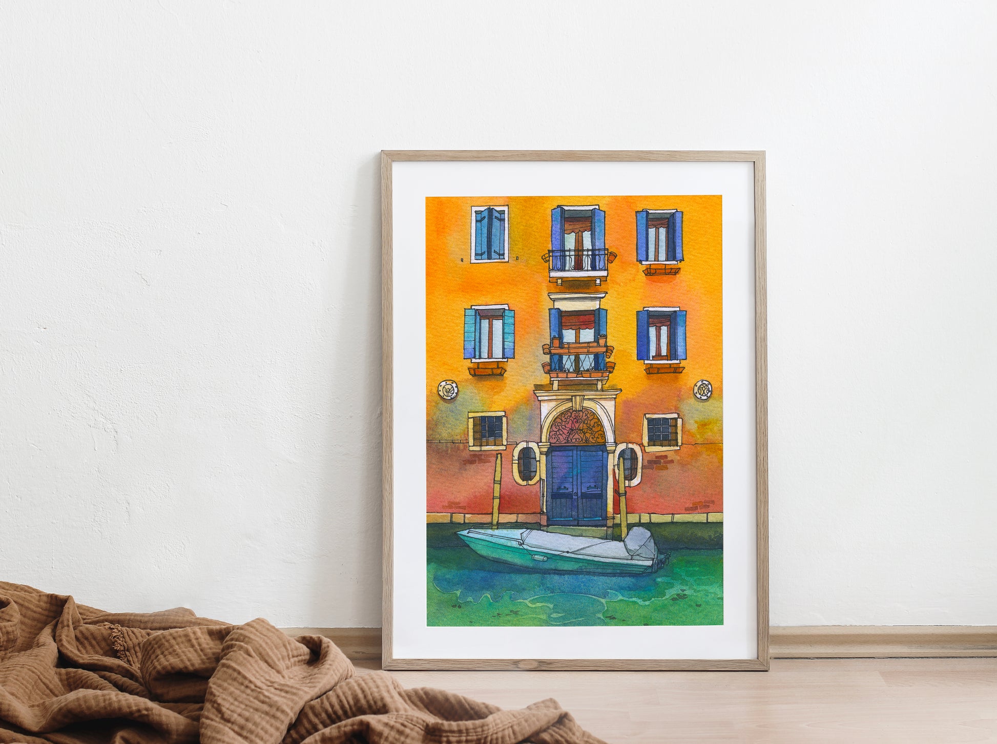 Large framed watercolor artwork of a yellow house with a boat on Fondamenta de la Misericordia in Venice