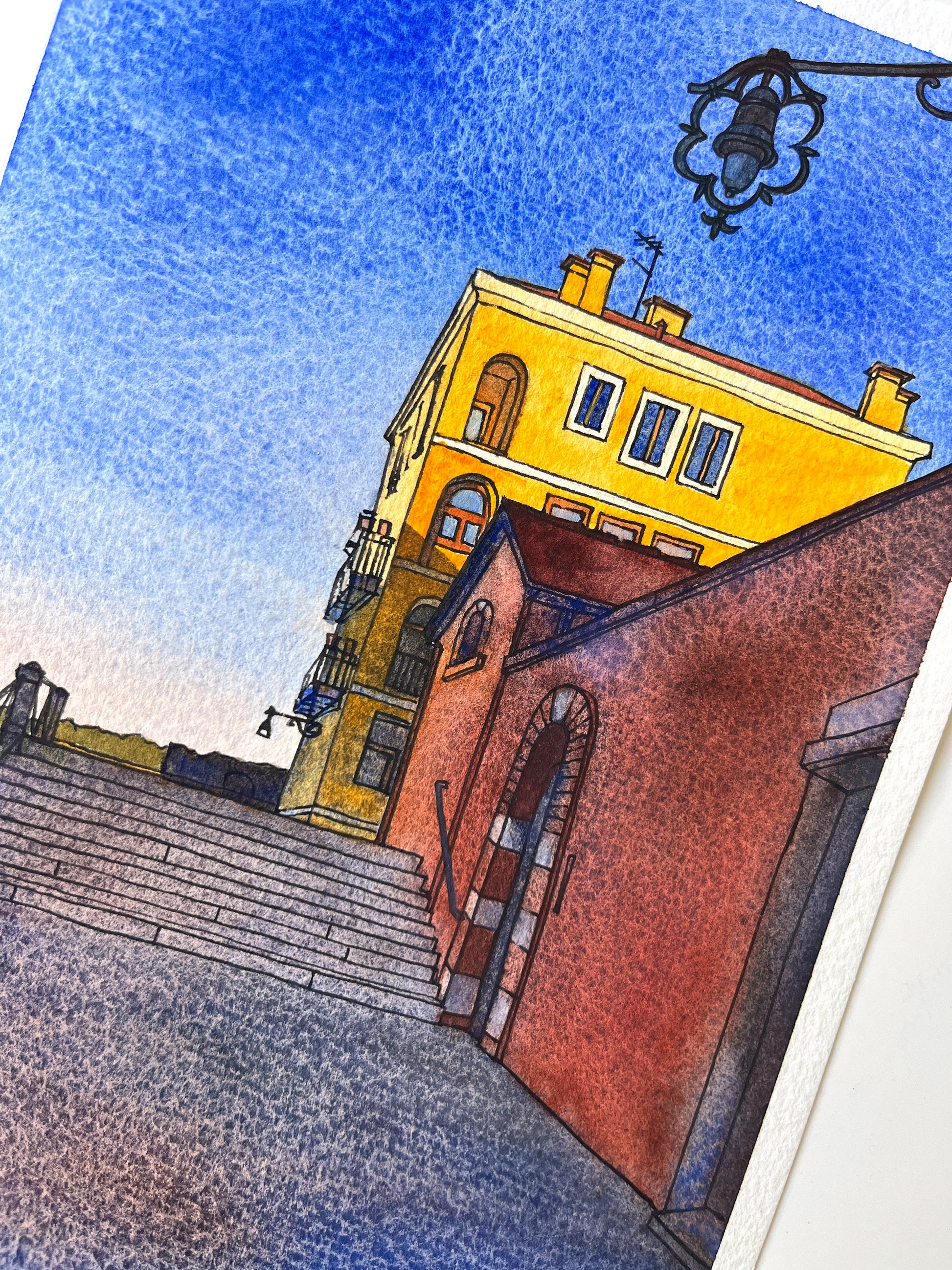 Close-up of original watercolor and ink artwork of a yellow building on Fondamenta Santa Giustina in Venice.