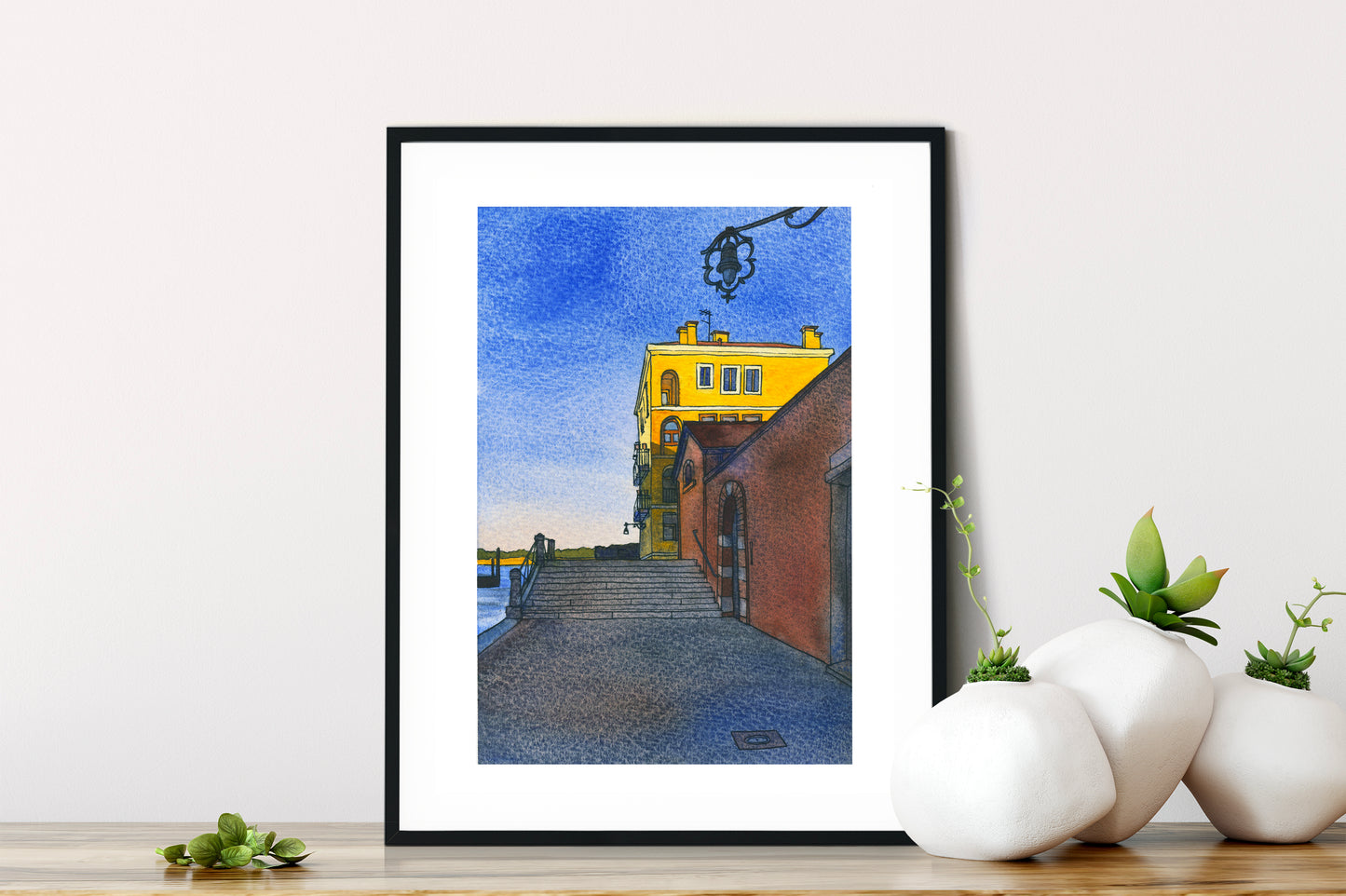 Framed watercolor and ink artwork of a yellow building on Fondamenta Santa Giustina in Venice.