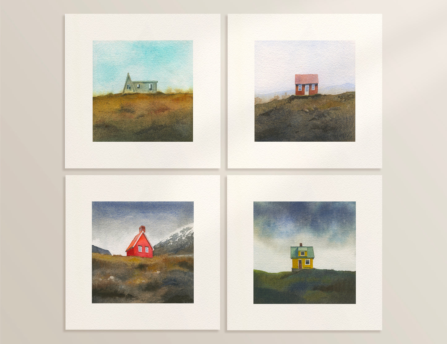 Four watercolor Icelandic landscapes — an A-frame cabin in the Westfjords, a red cottage in the Icelandic hills, a red cabin near Egilsstaðir in East Iceland, and a colourful house on Flatey Island.