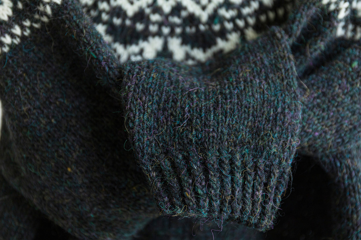 Close-up of Nattuggla Nigh Owl knitted sweater, showing a ribbed cuff.
