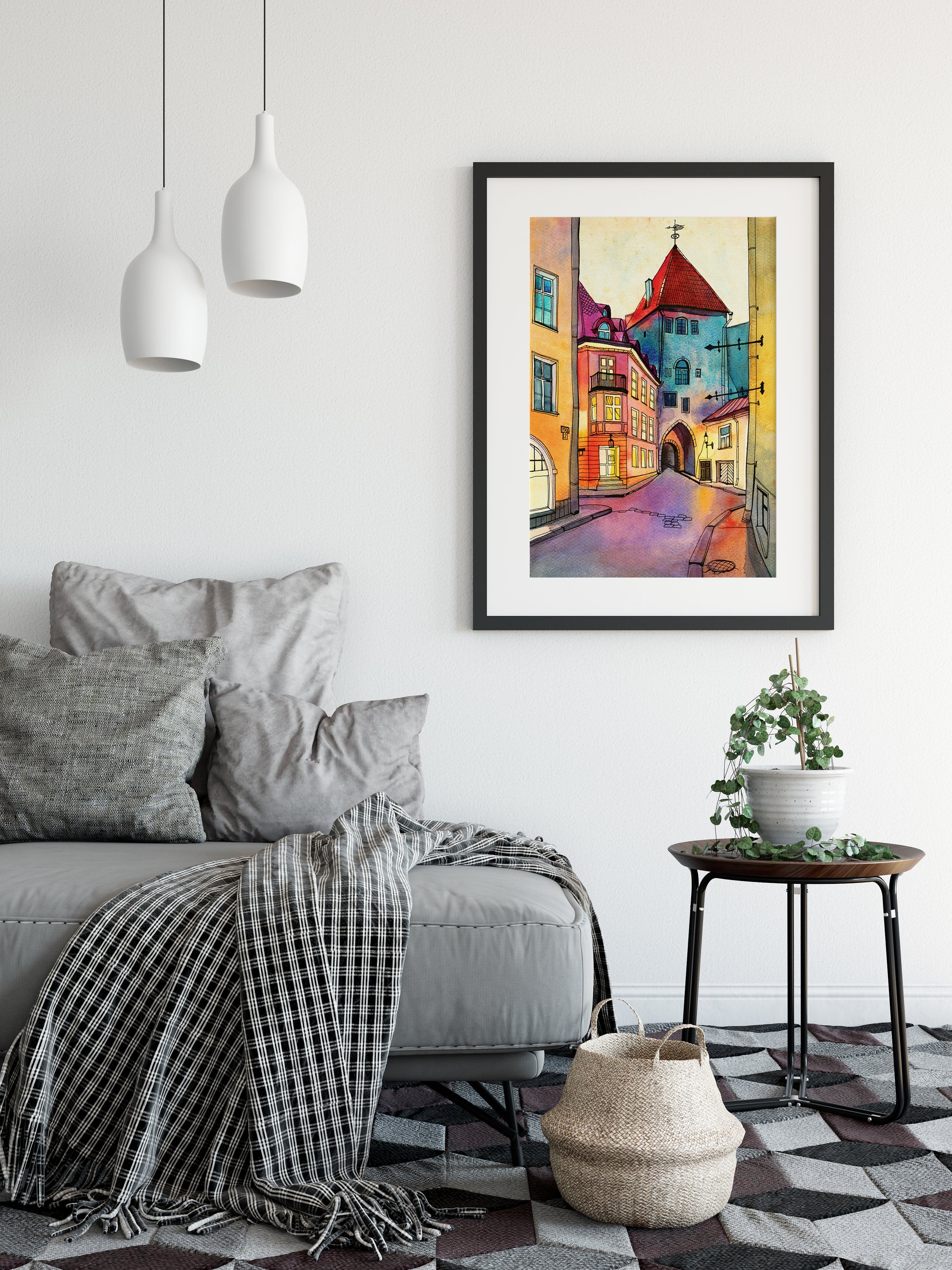 Large framed art print featuring Pikk street in Old Tallinn, Estonia, hung on a white wall above a gray sofa in a modern living room setting.