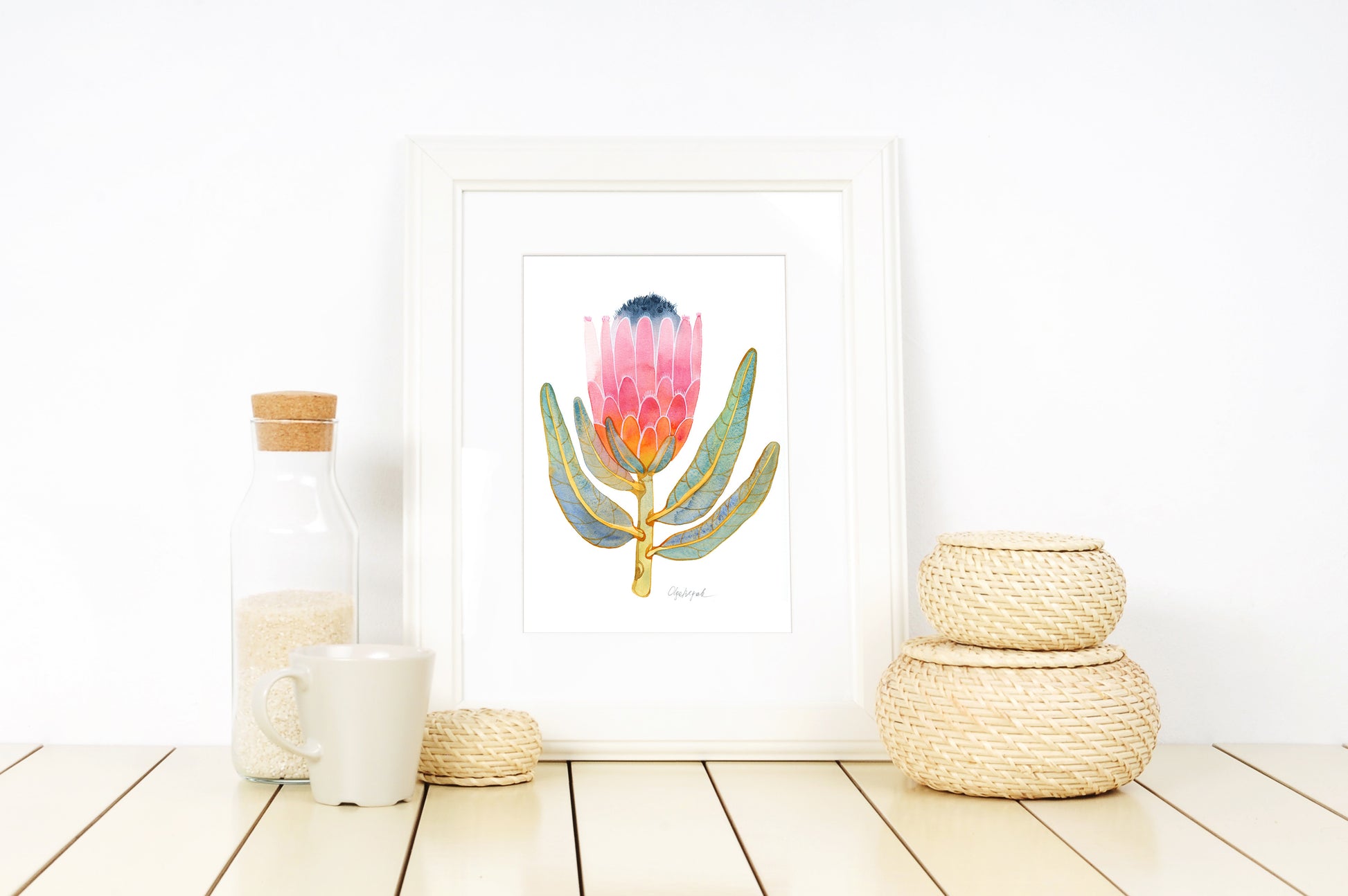 Small pink King protea watercolor art print in a white frame