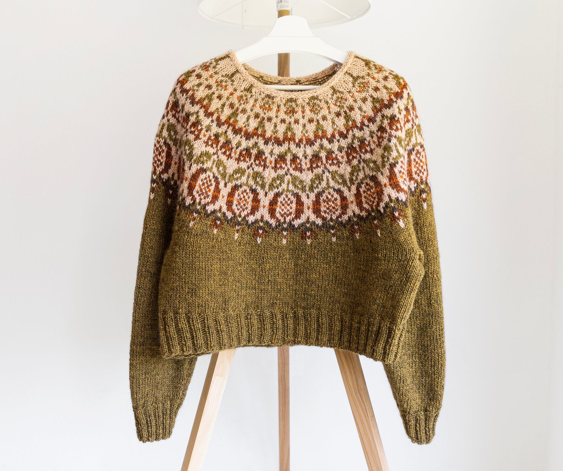 Front view of pomegranate Icelandic lopapeysa sweater with colorwork yoke