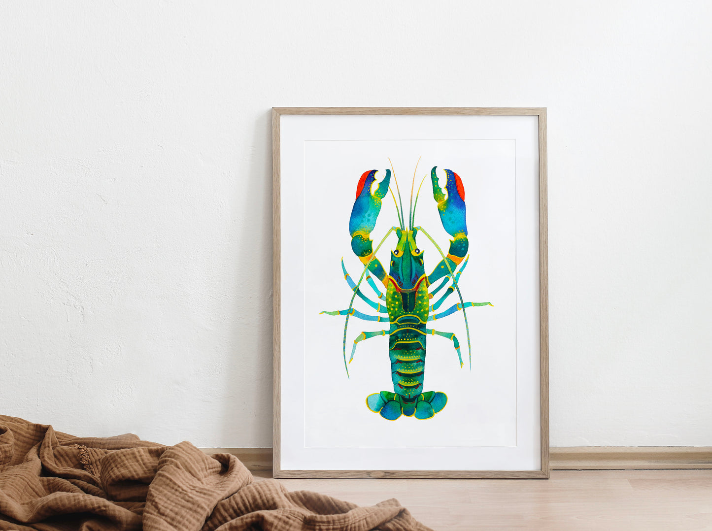 Red Claw Crayfish watercolor art print in a wooden frame on a floor