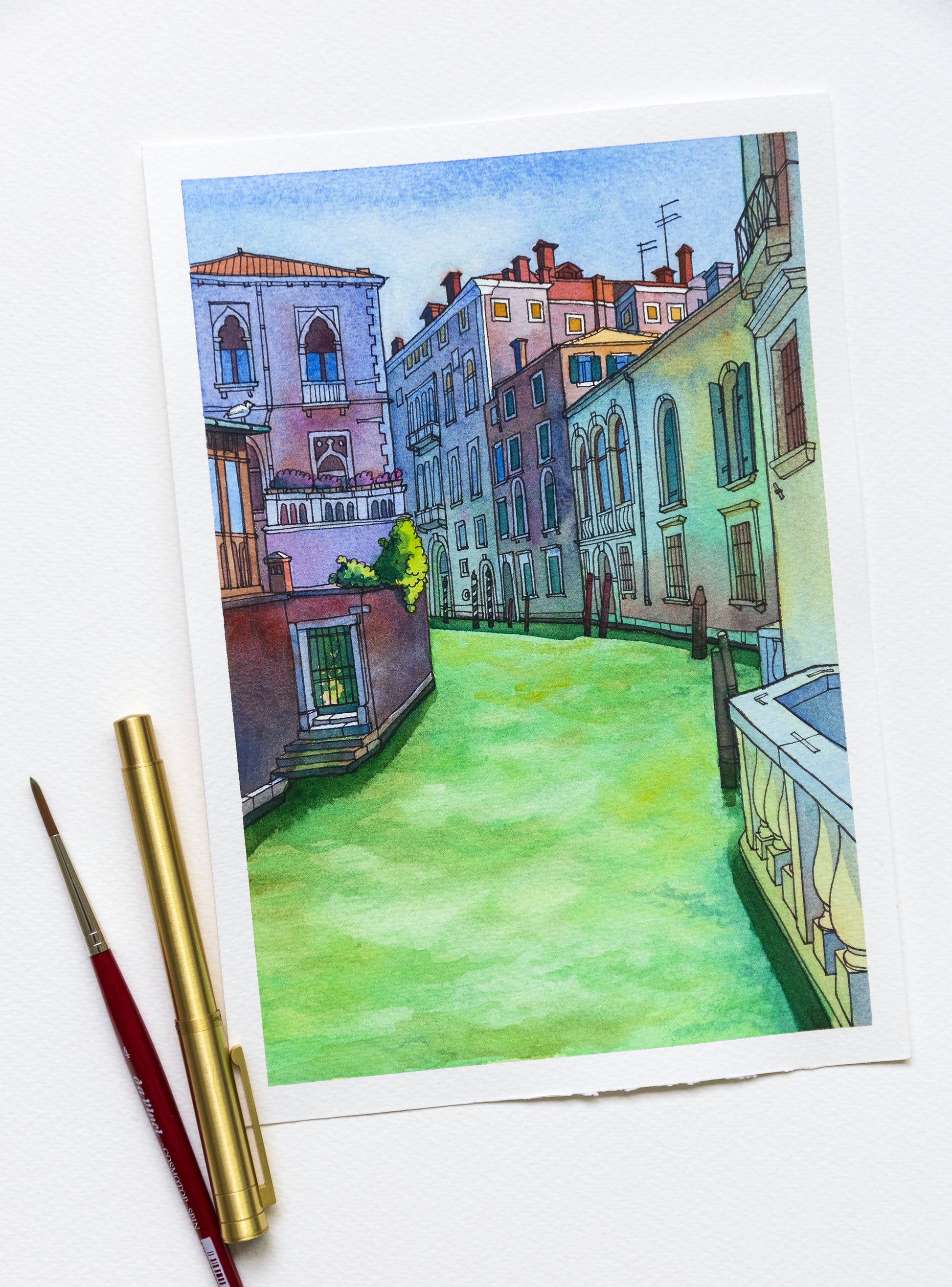 Original watercolor and ink illustration of of Rio di San Polo in Venice scene accompanied by art supplies