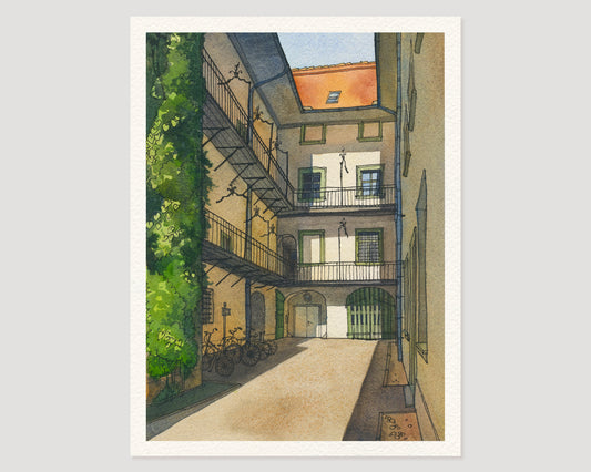 A watercolor and ink artwork features a European courtyard on Sackstrasse 16 in Graz, Austria, with its historic buildings, balconies, bicycles, and a green vine, presented on a light gray background.