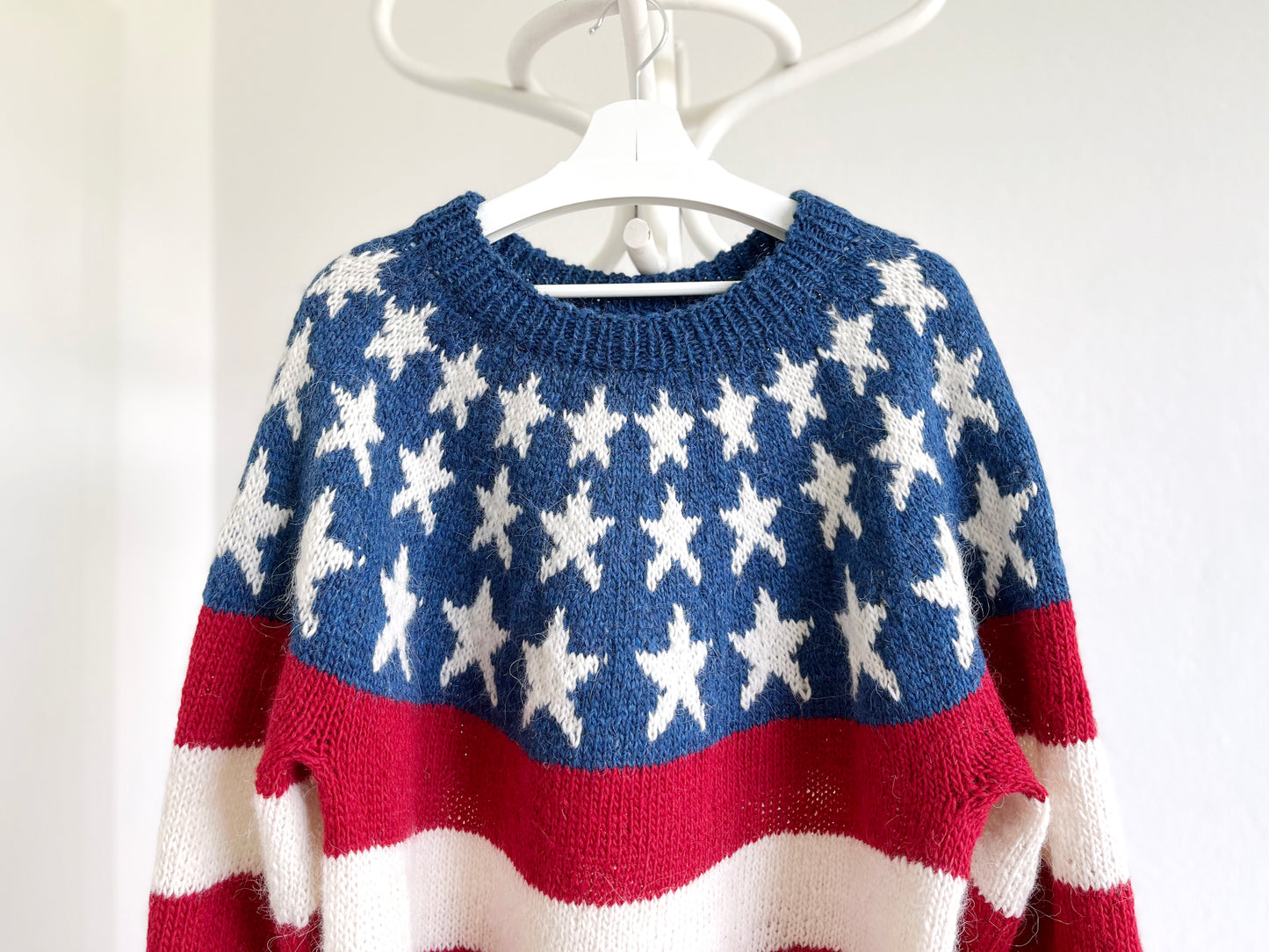 Yoke of a hand-knitted lopapeysa sweater in the stars and stripes american flag design