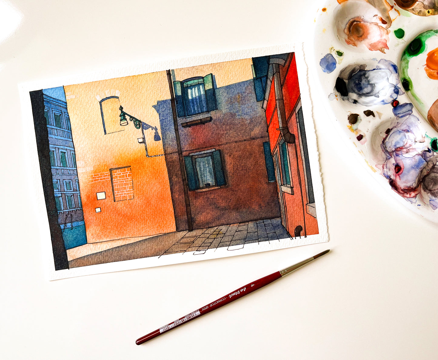 Venice canal street original watercolor and ink artwork, accompanied by art supplies